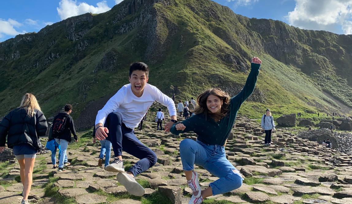 students jump for a fun photo in Ireland