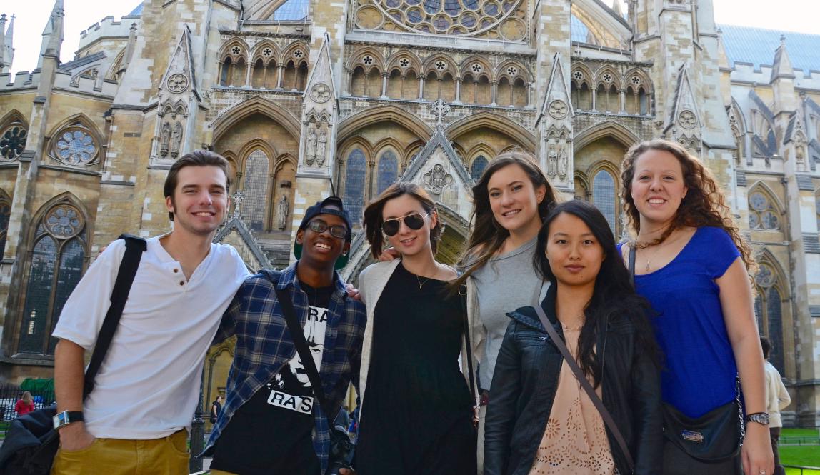 a group of students pose for a photo at Westminster Abbey