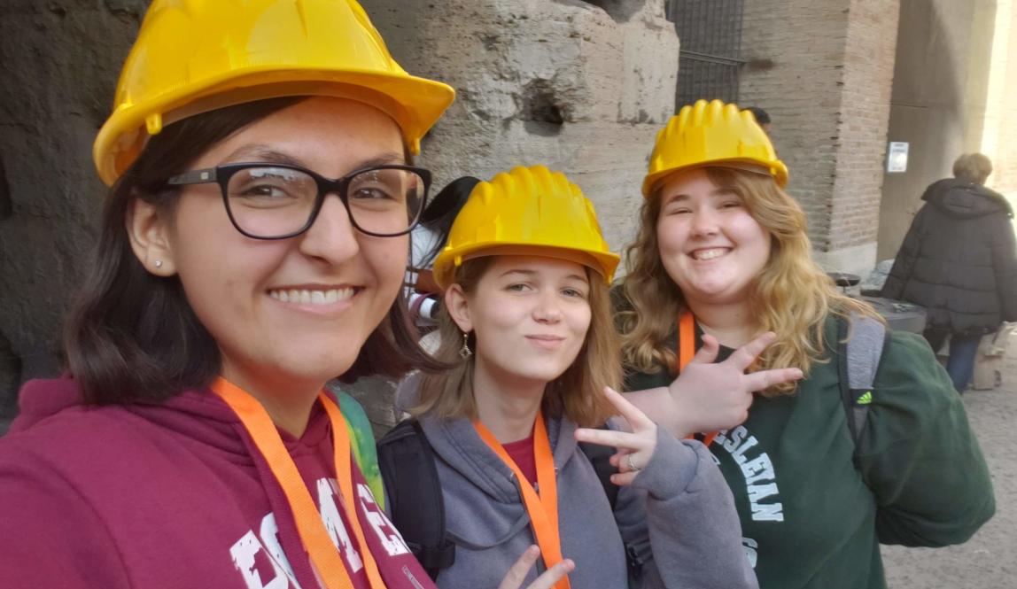student interns pose for a photo while working at an archeological site in Rome