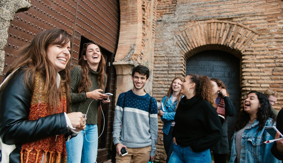 Students laughing with instructor in Alhambra