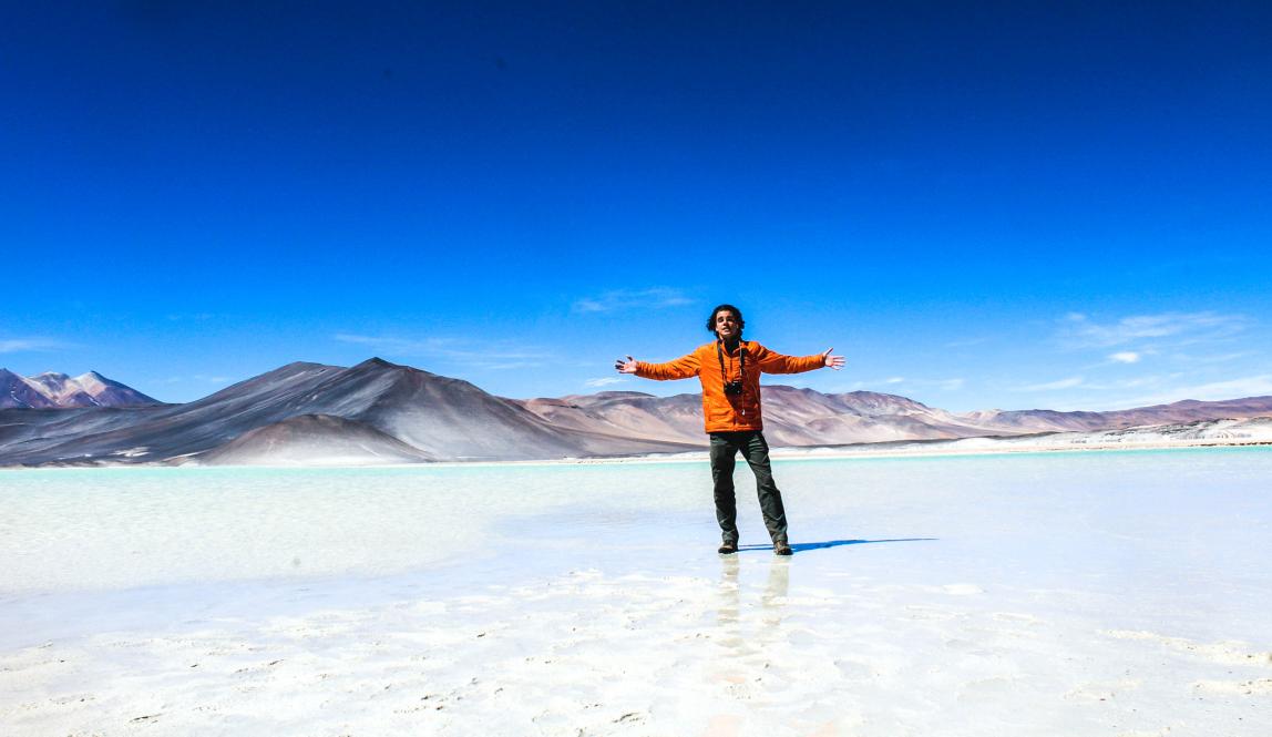 a student poses for a fun photo on the salt flats in San Pedro de Atacama, Chile