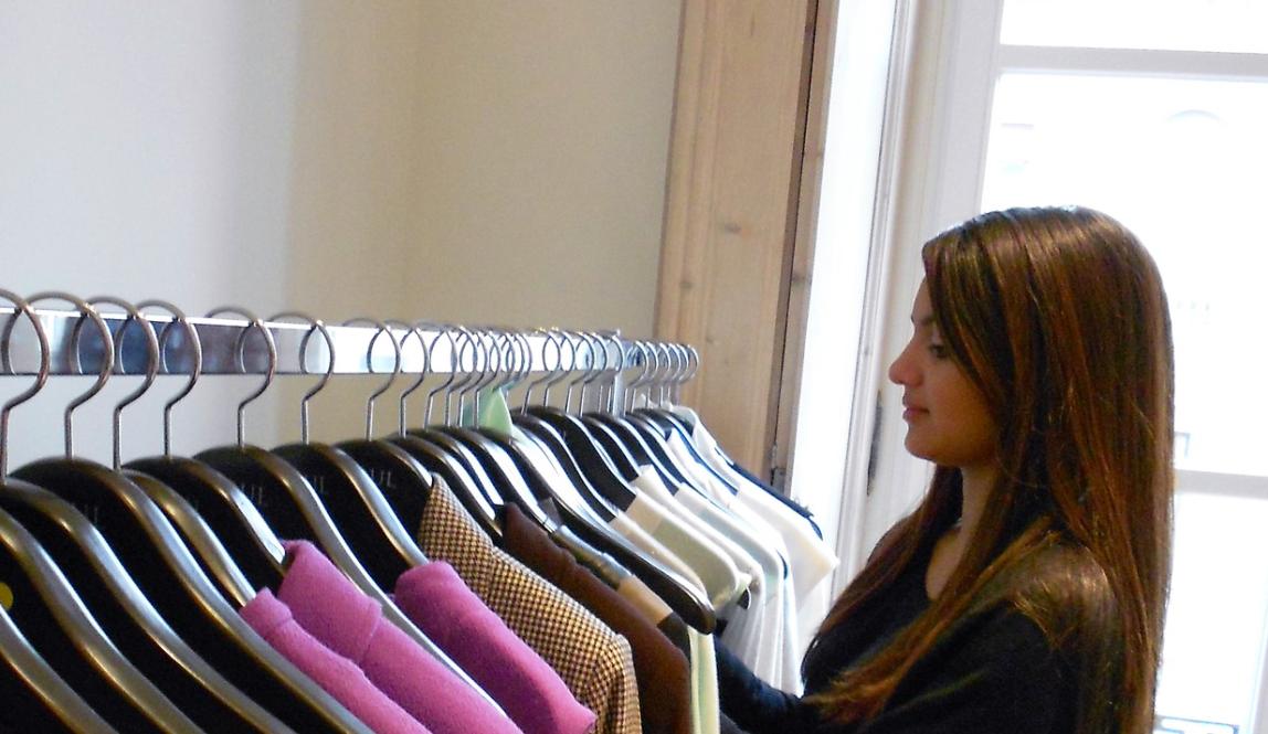 a fashion student arranging clothes in Milan