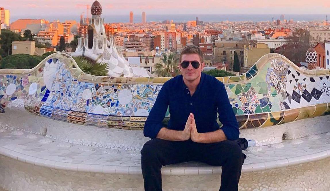 a male student poses for a photo at Park Güell
