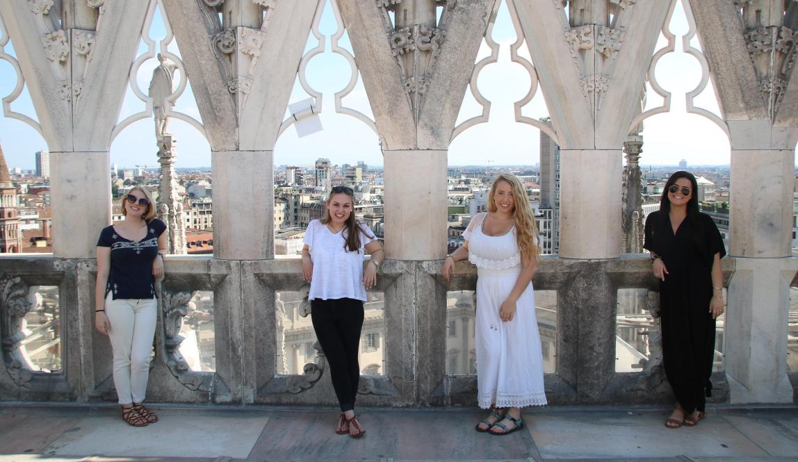 students pose for a photo on the roof of Duomo di Milano