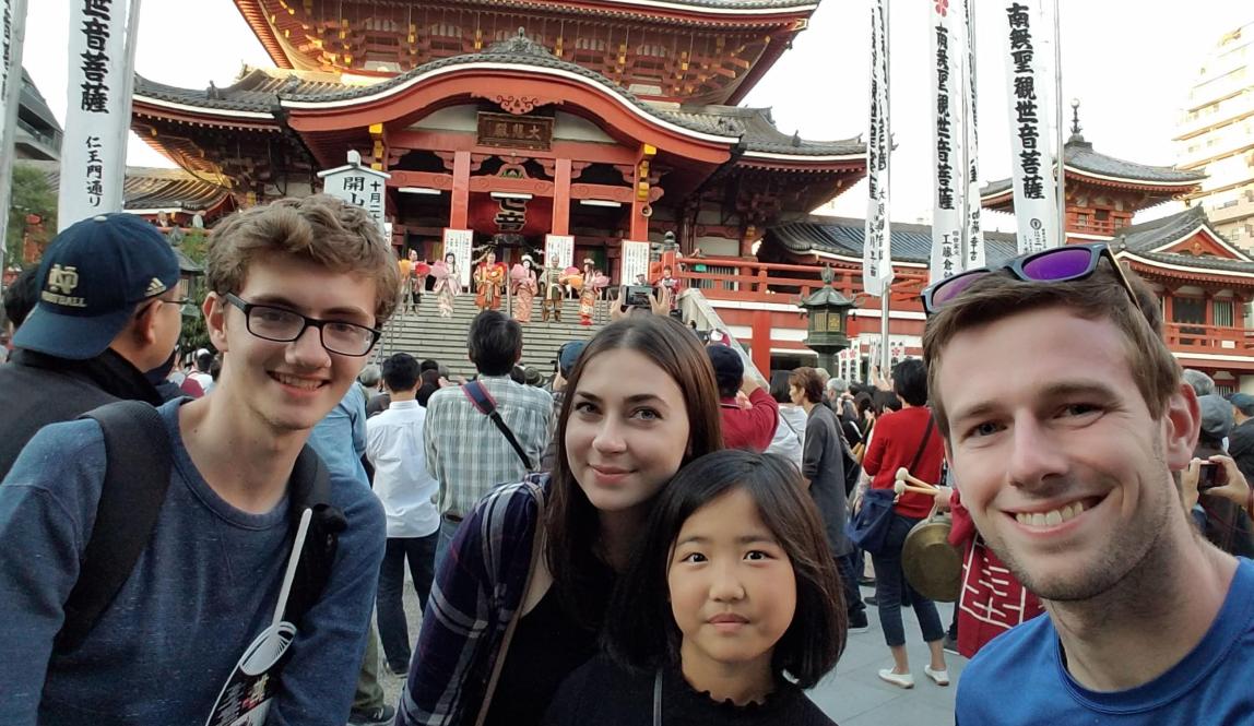 a group of students pose for a photo at the Osu Kannon Buddhist temple in Nagoya
