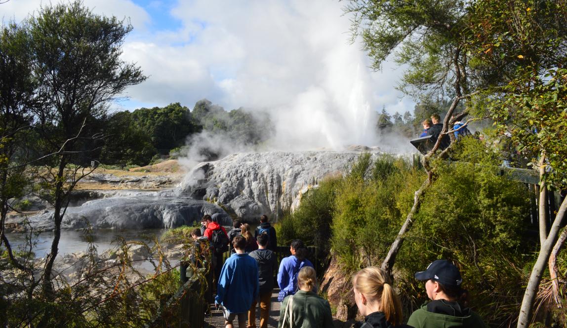 students walking through a geothermal area in Rotorua