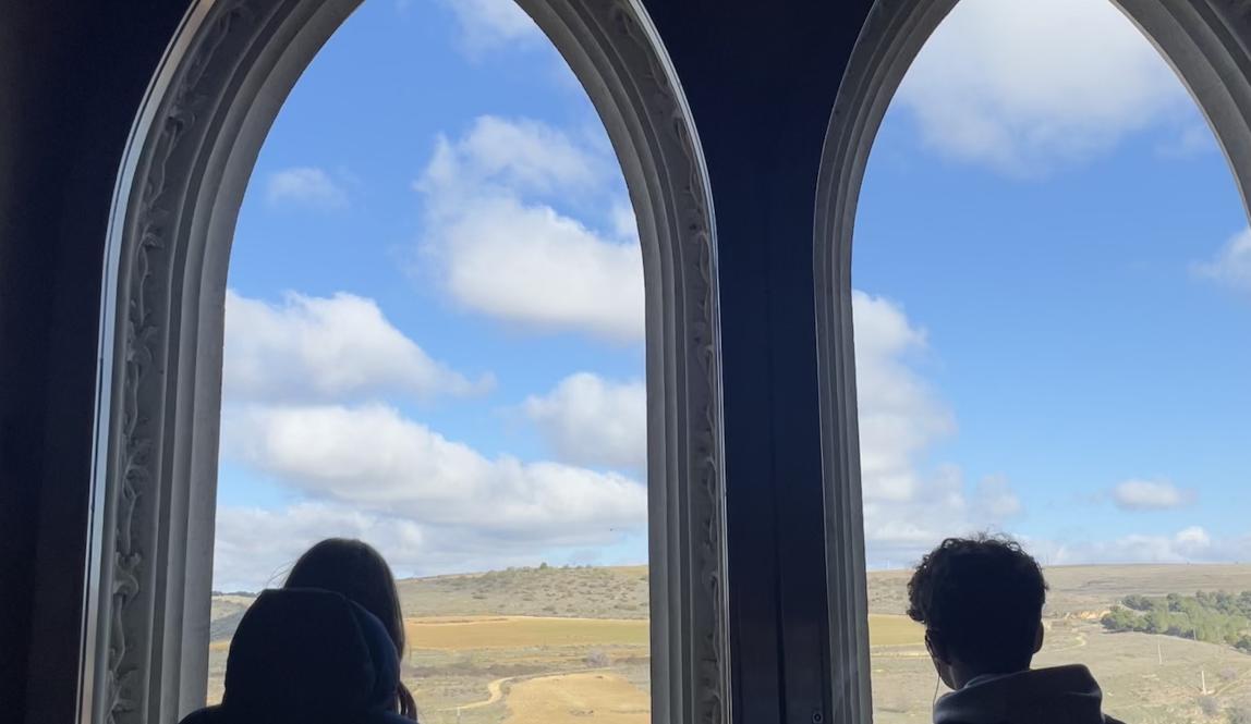 Peers looking out the Segovia castle's window