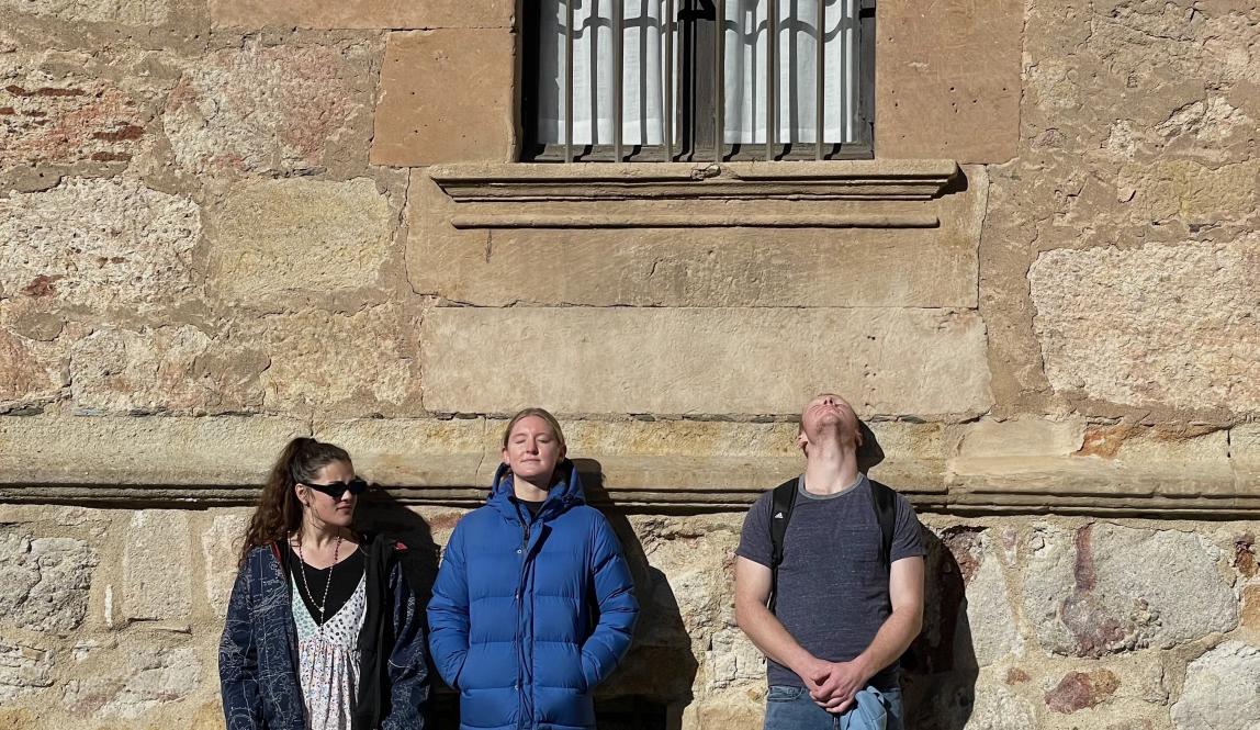 My friends soaking up the sun in cold Salamanca