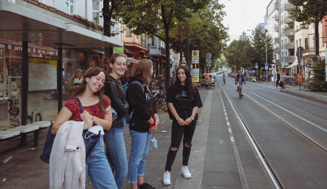 Students waiting to cross the road in Berlin, Germany.