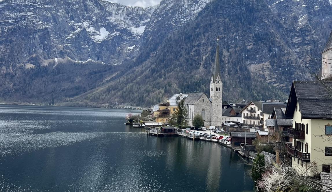 postcard shot featuring the church, lake, mountains