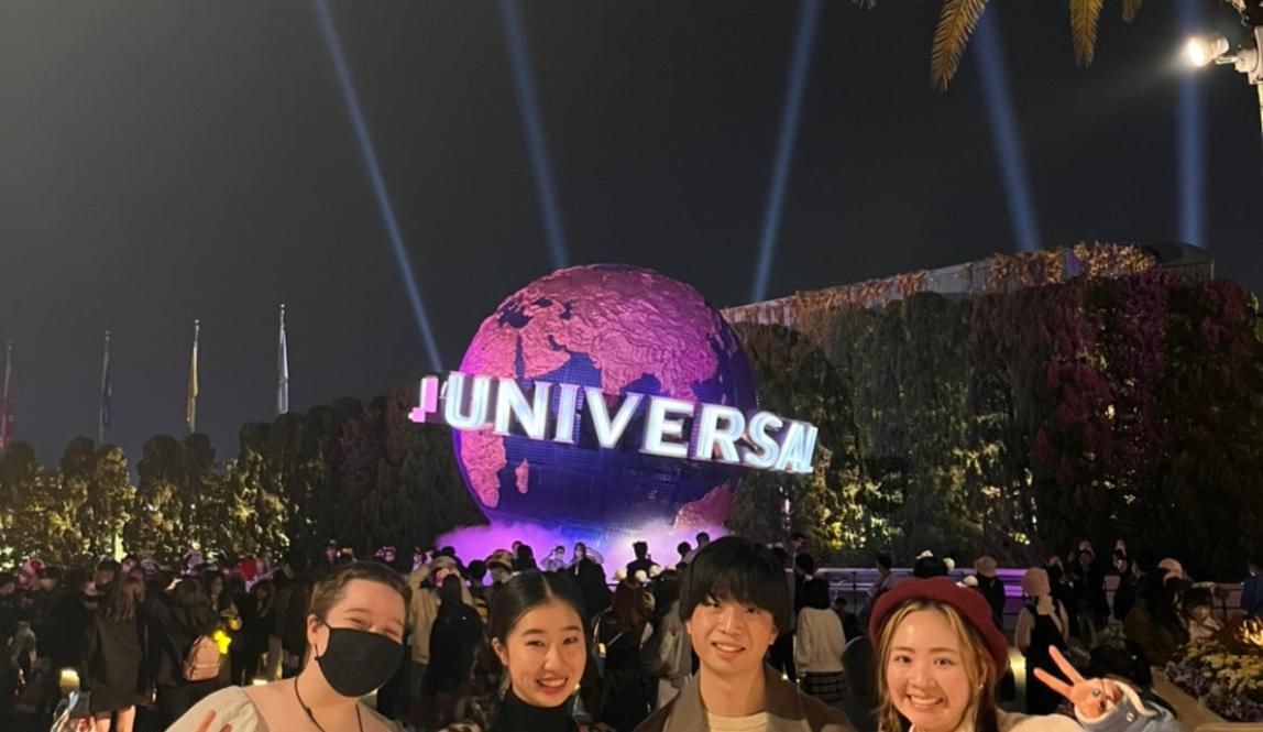 Author, Macks, standing with friends that he went to Universal Studios, Japan with in front of the Universal Globe.