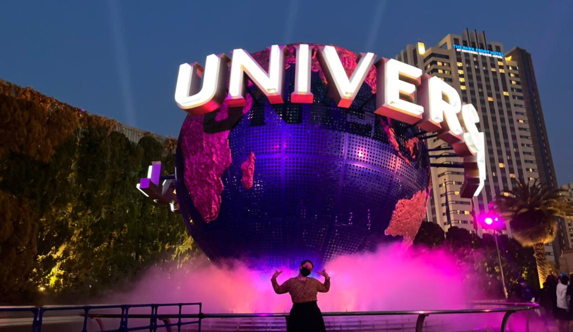 Author, Macks, standing in front of the Universal Globe in Universal Studios, Japan.