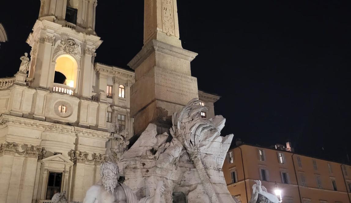 Shown is the central statue in Piazza Navona at night time