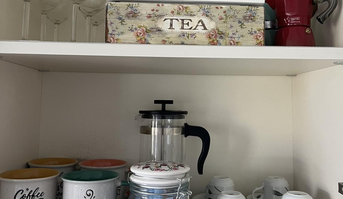 cute coffee mugs & moka pots in airbnb kitchen  