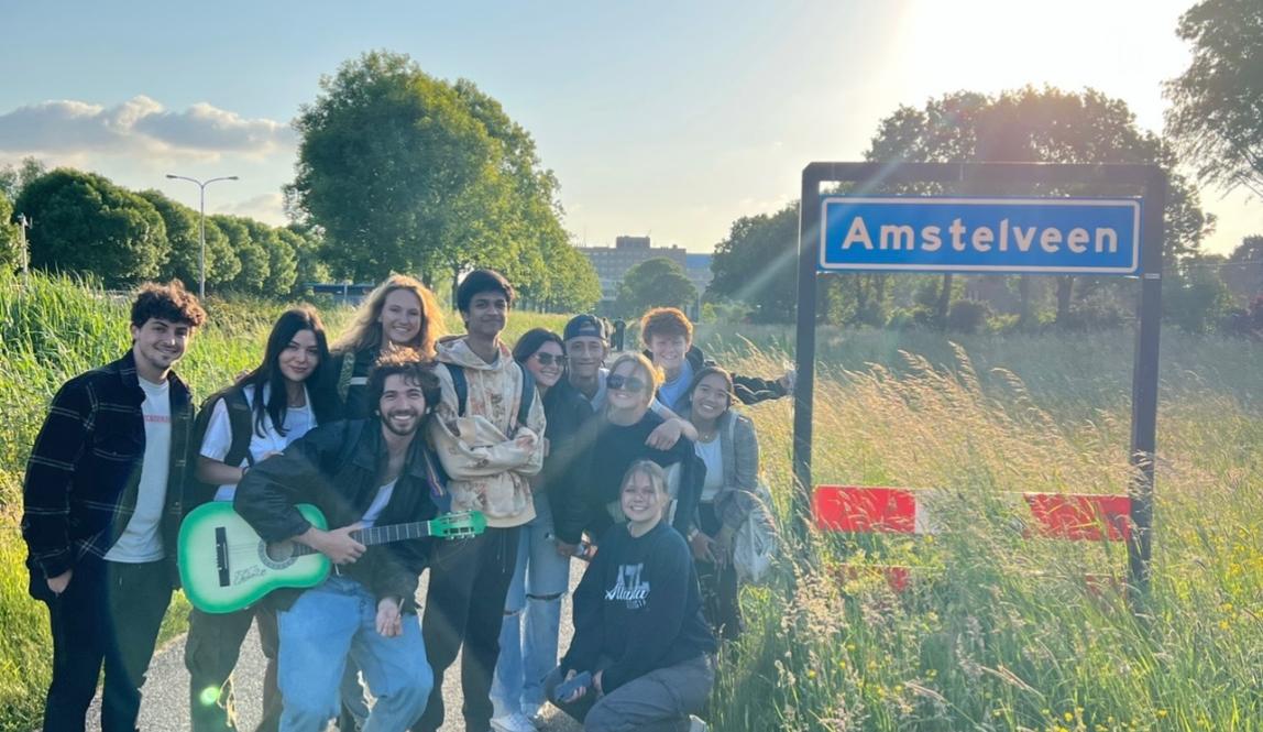 A photo of a group of my friends and I by the Amstelveen sign during our walk home one day