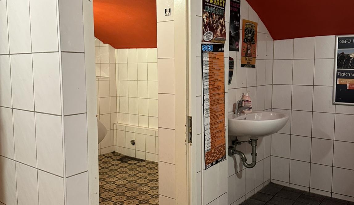 a white and orange bathroom