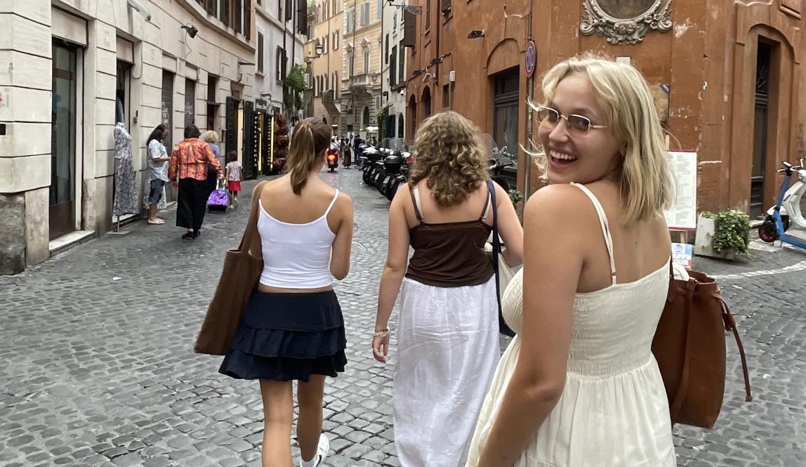 A photo of new friends strolling down an unexplored street