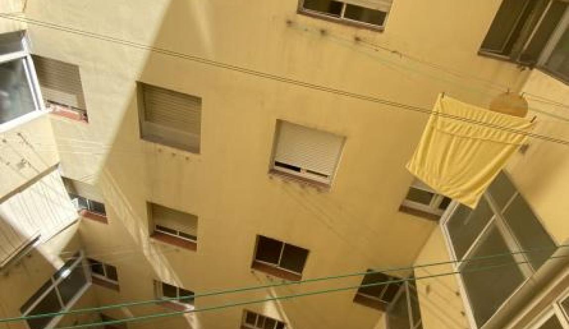 An image of the view from outside my window in my host mom's house. I can see all of the other windows that face towards the center courtyard in the apartment building, and everyone's clotheslines are hung up for when they need to dry their laundry.