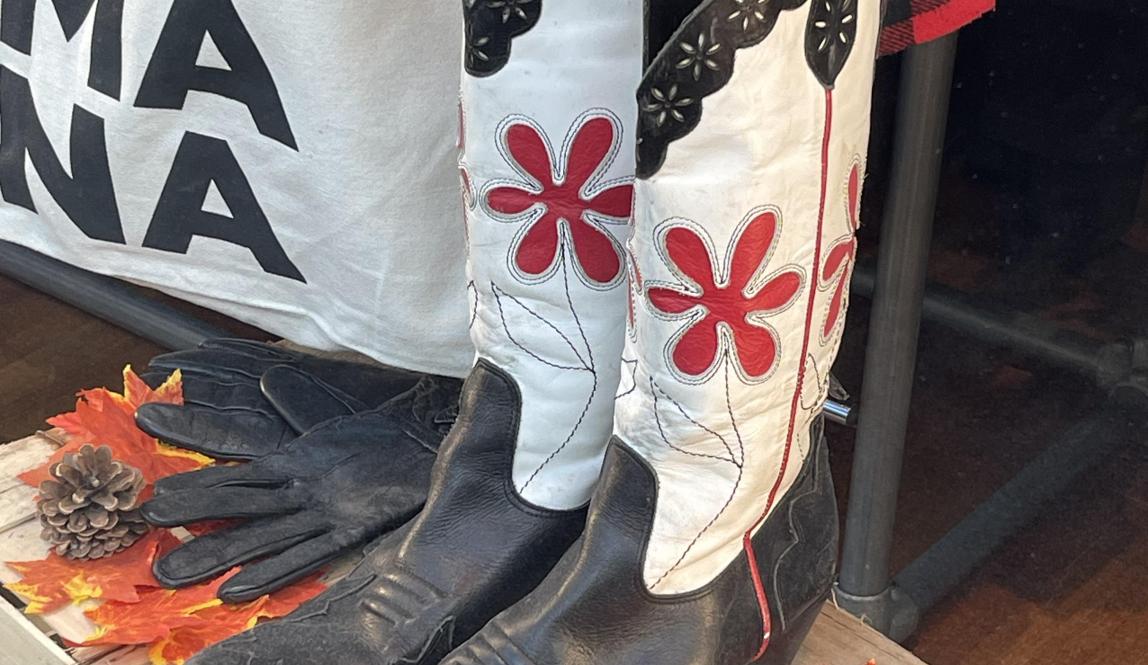A photo of a cool pair of boots in the window of Humana Vintage