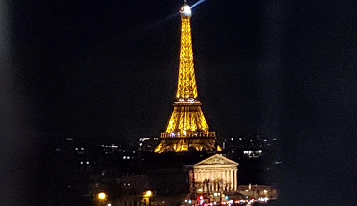 The Eiffel Tower lit up from the top of the Ferris Wheel in the Paris Fair