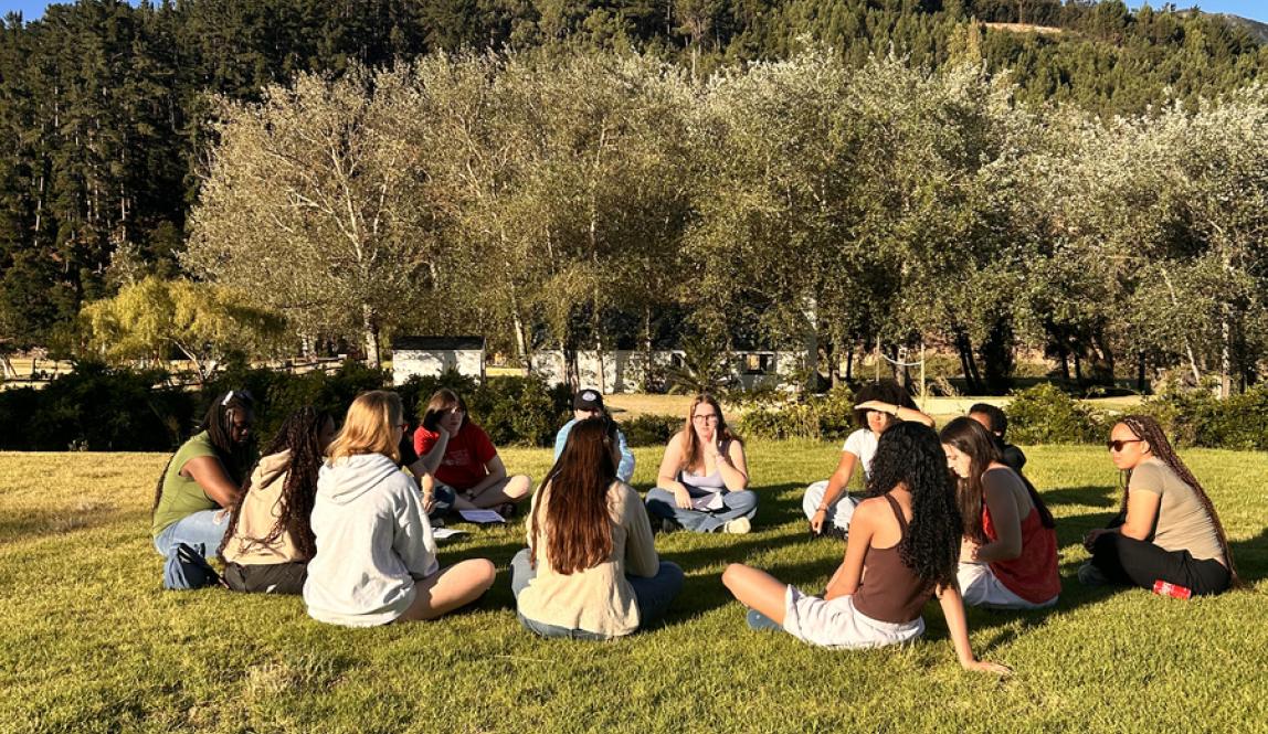 Students in Cape Town sitting in circle outside
