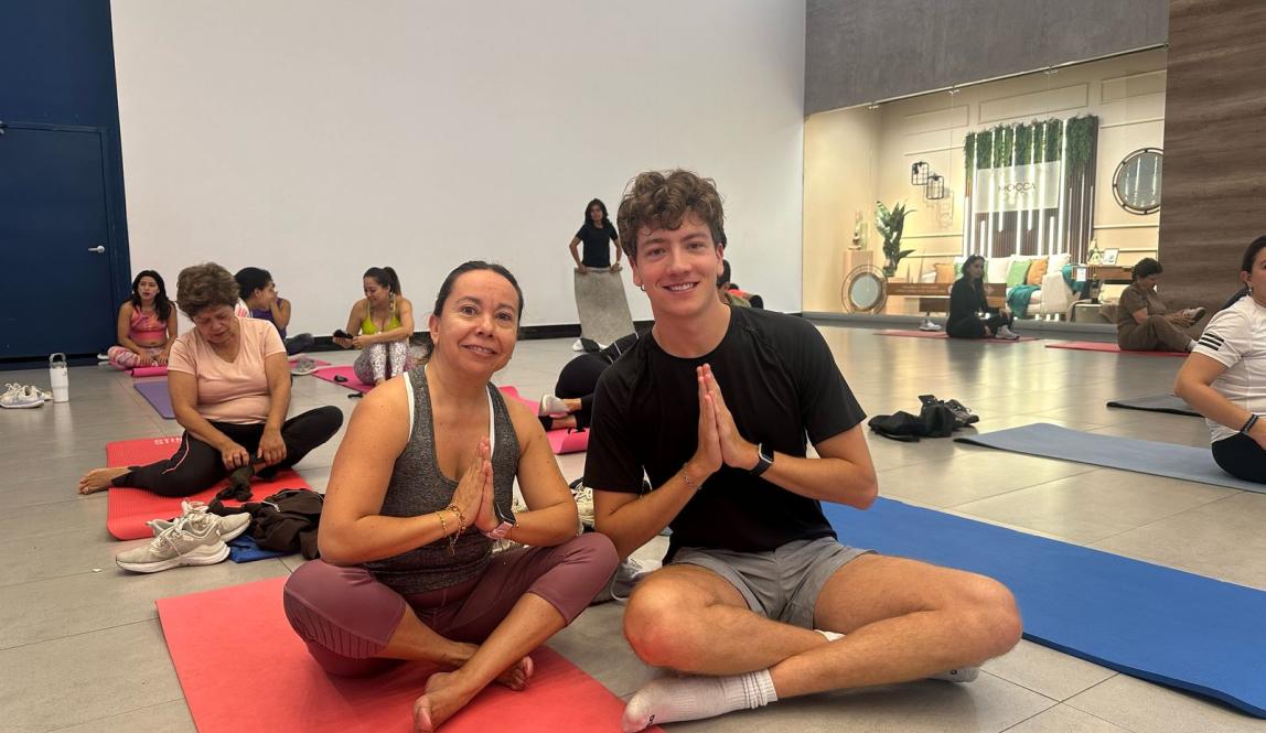 my and my host mother in criss-cross applesauce sitting on yoga mats