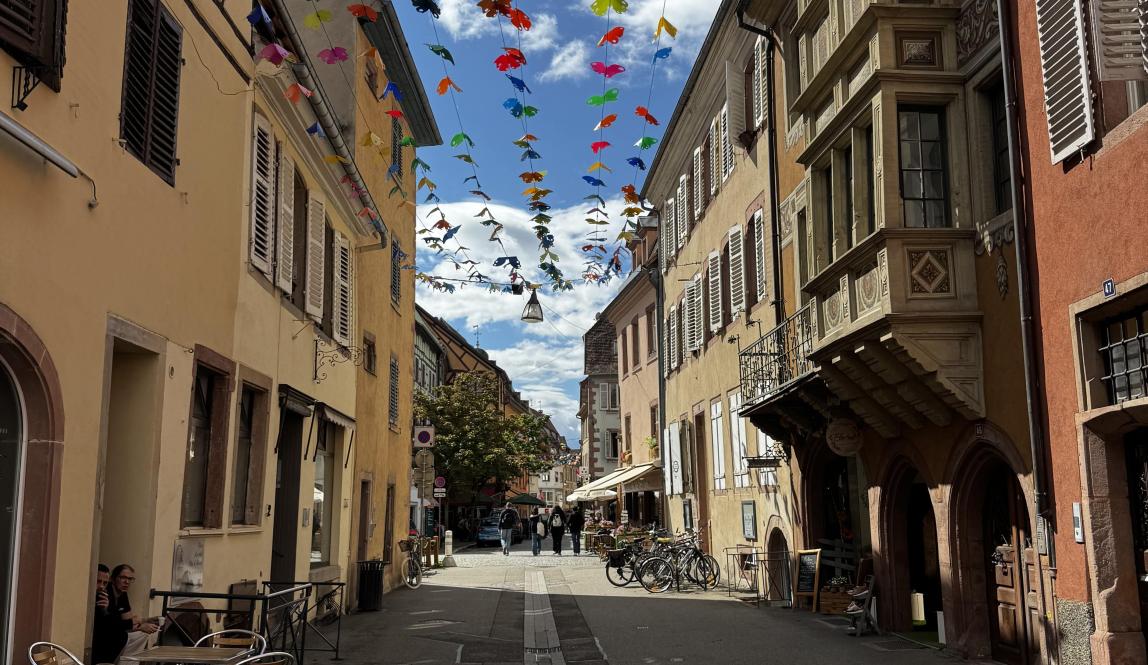 A street with banners hanging between houses