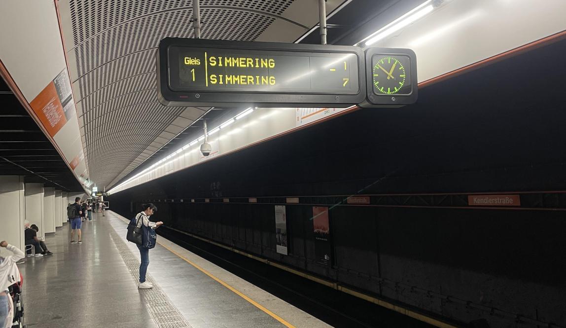 Station platform with digital sign