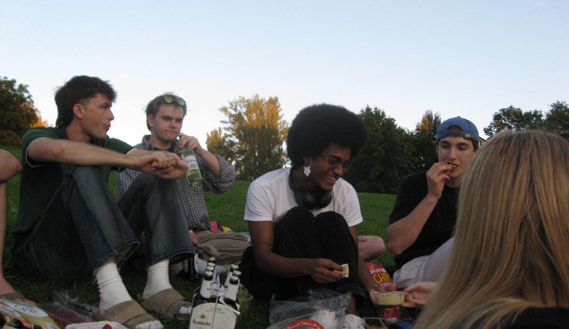 People sitting on ground for picnic