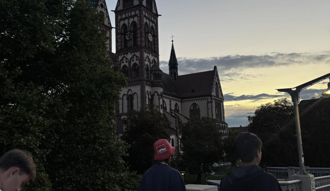 People walking past some buildings