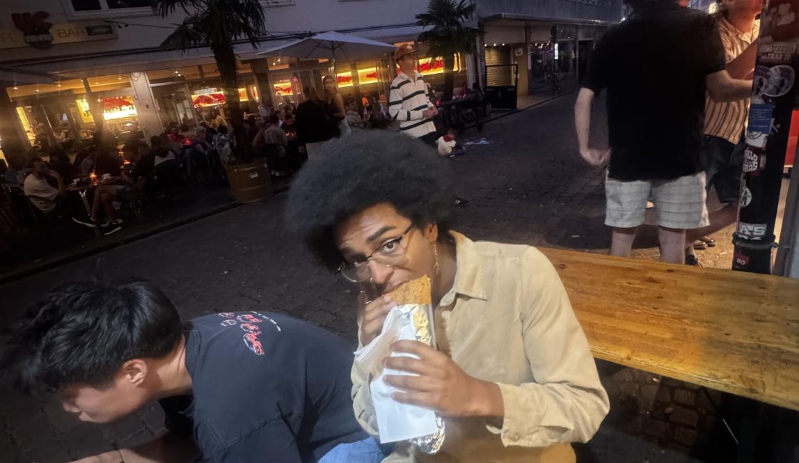 Person eating on a bench