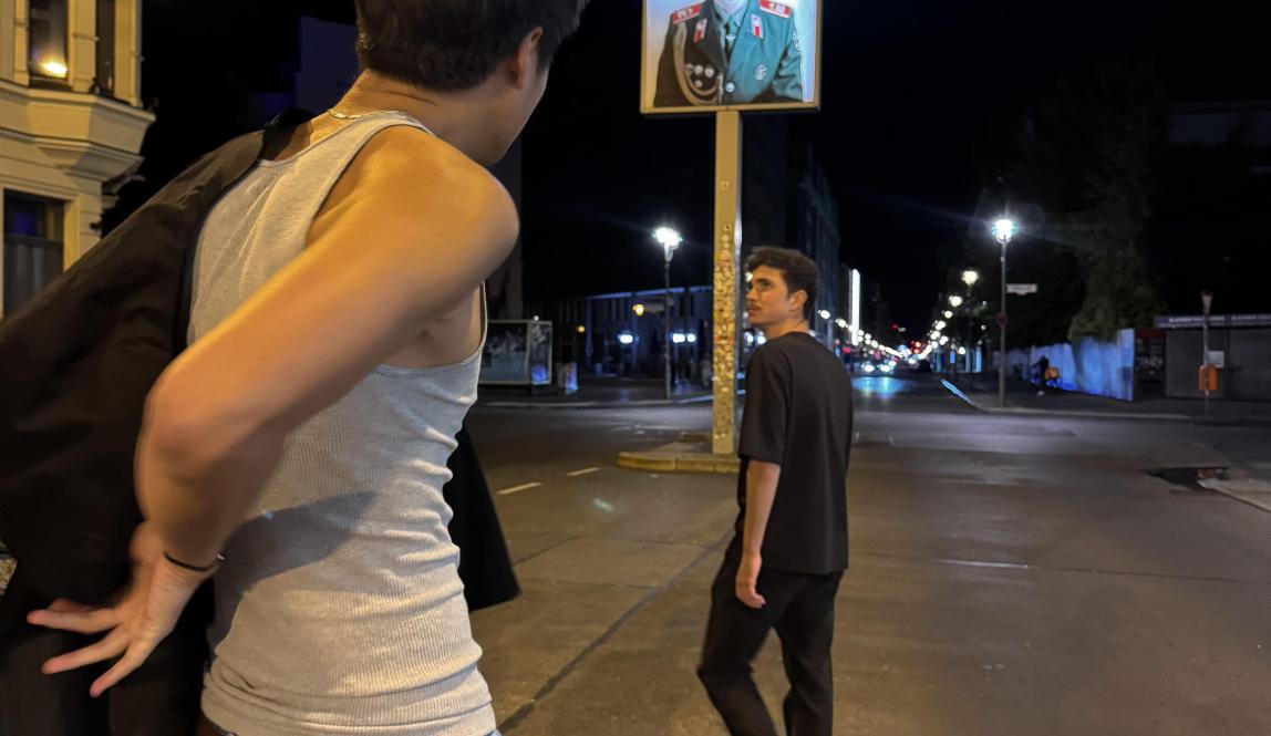 Two people standing on the street
