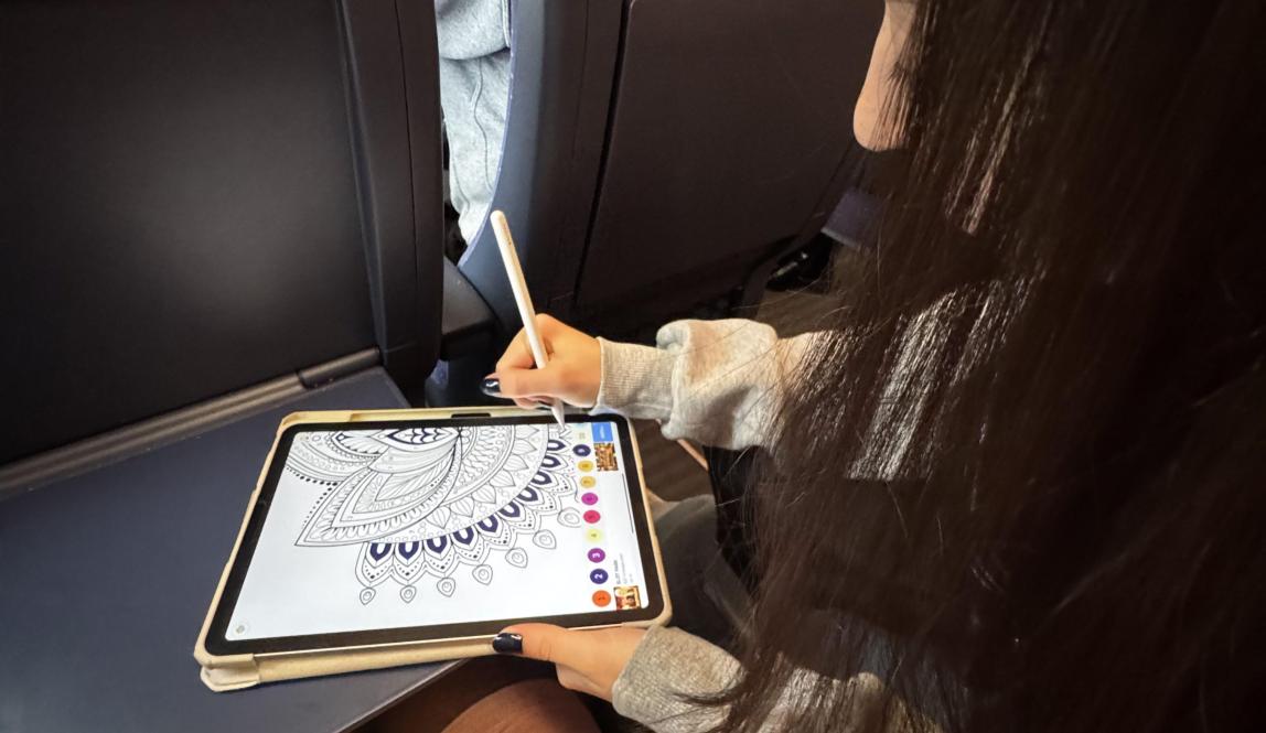 A Girl playing iPad games
