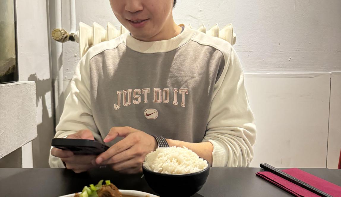 Someone eating food at a table