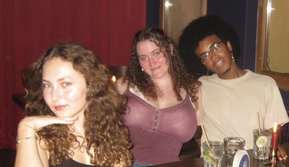 Three friends at a bar