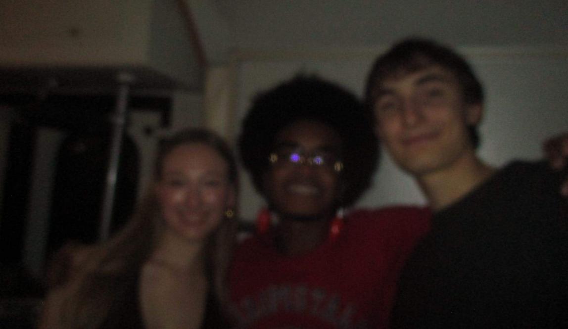 Three friends posing for a photo