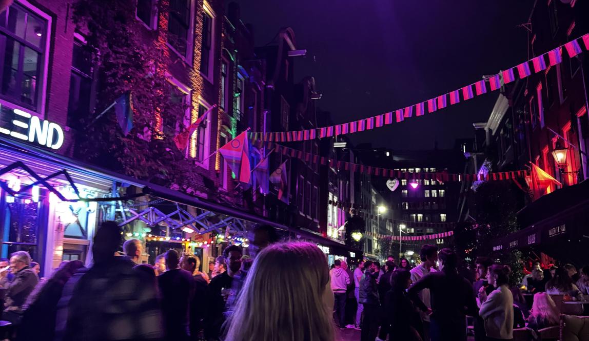 A street with banners hanging between houses