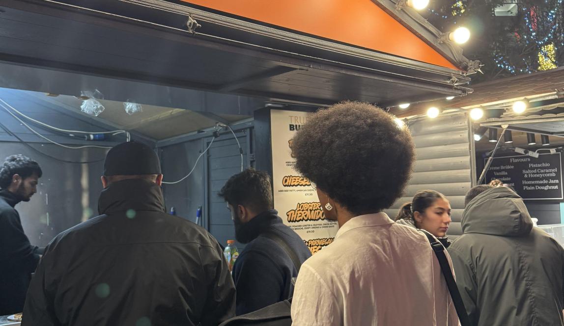 Man in line for a truffle burger