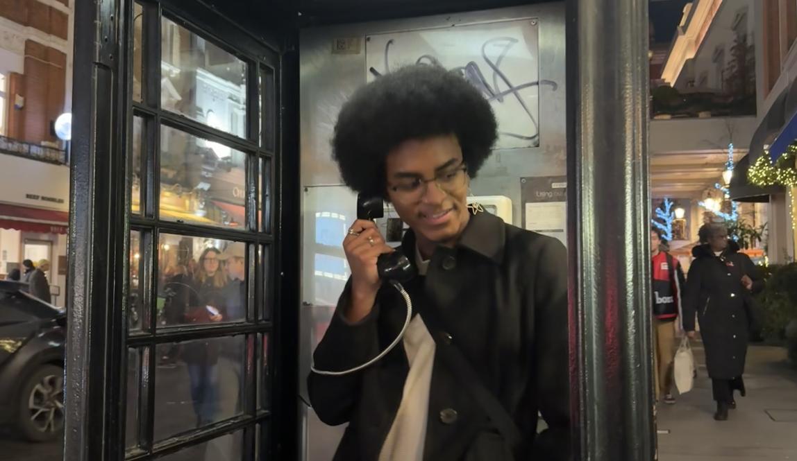 Man in telephone booth