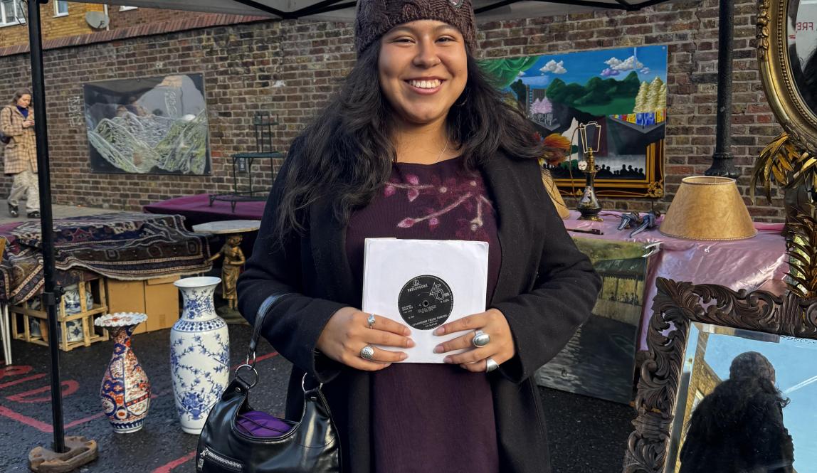 Woman holding records