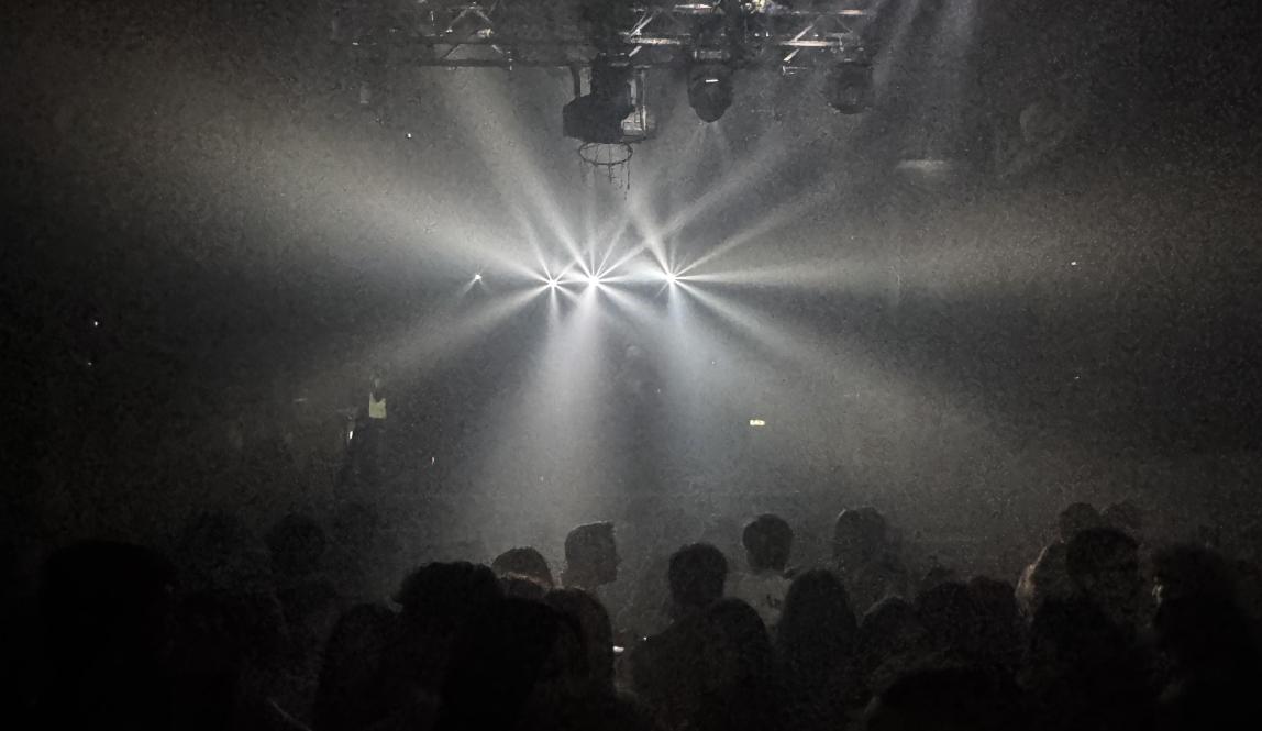 A bright light and shadows of people