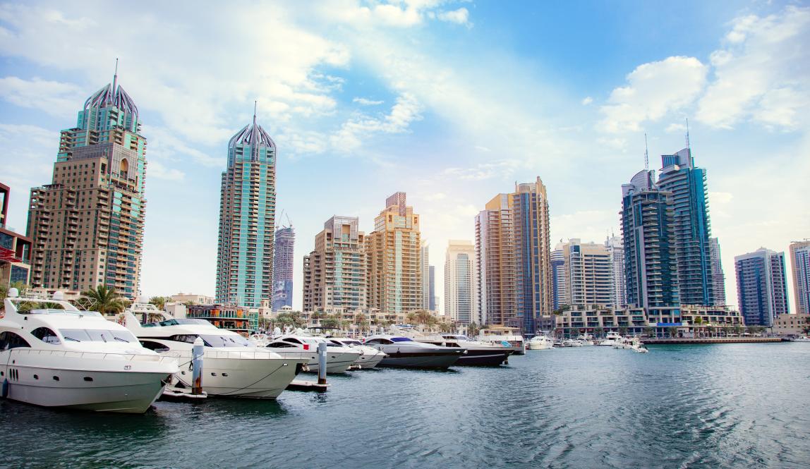 boats in front of dubai skyline
