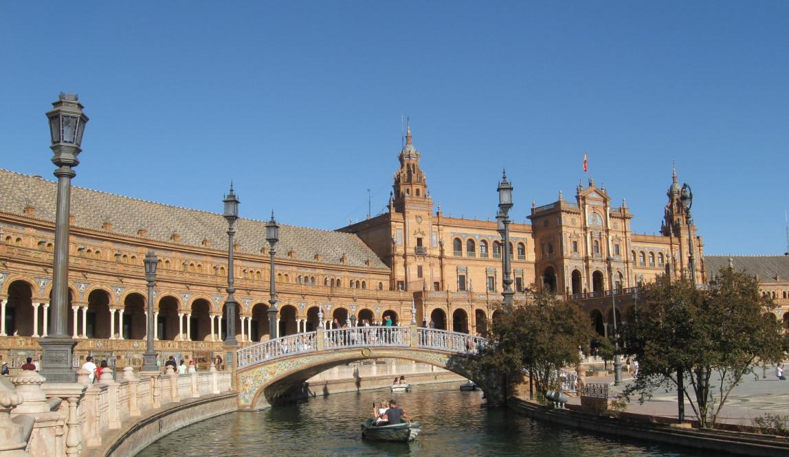 The river in Salamanca filled with rowboats.