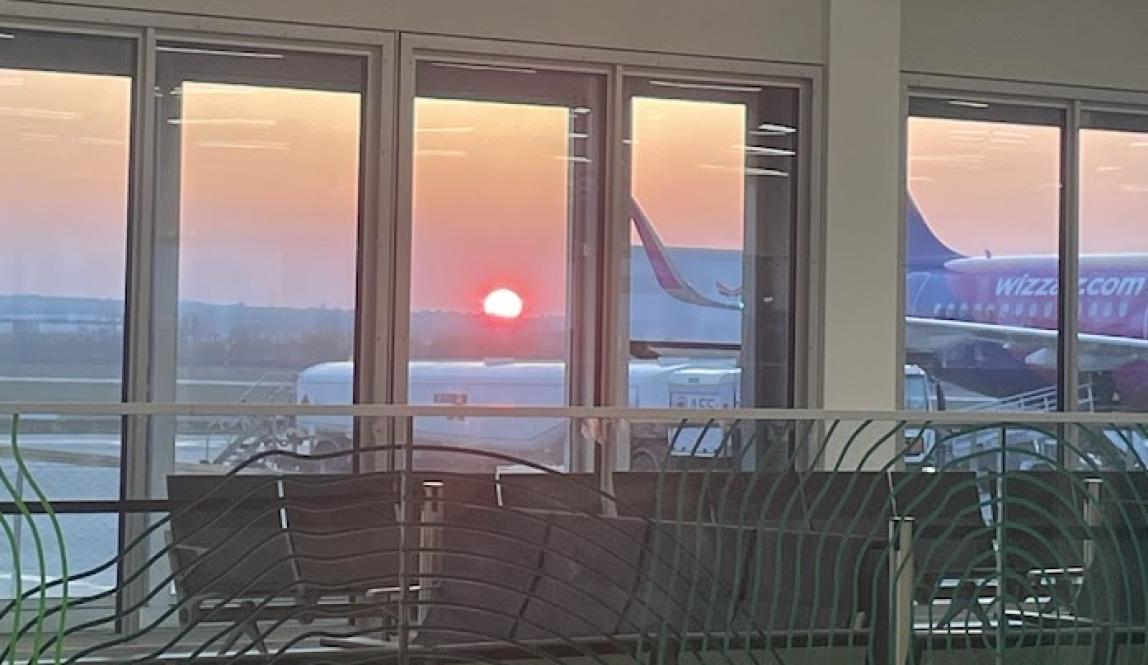 sunrise visible through the windows of airport
