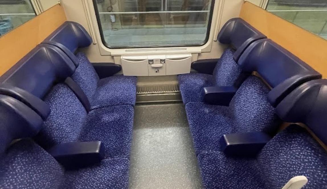 six seats in a train compartment