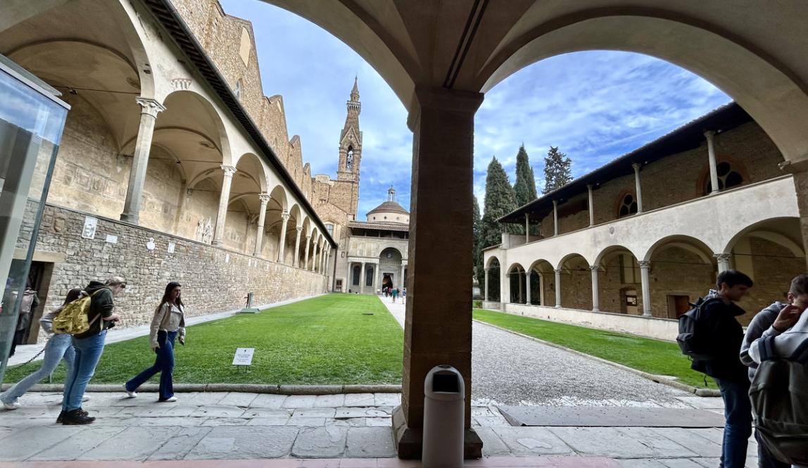 Courtyard in Florence with students walking through it