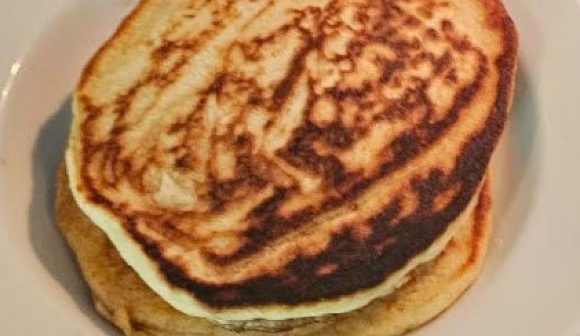 A stack of about 4 pancakes with a beautiful brown marbling.