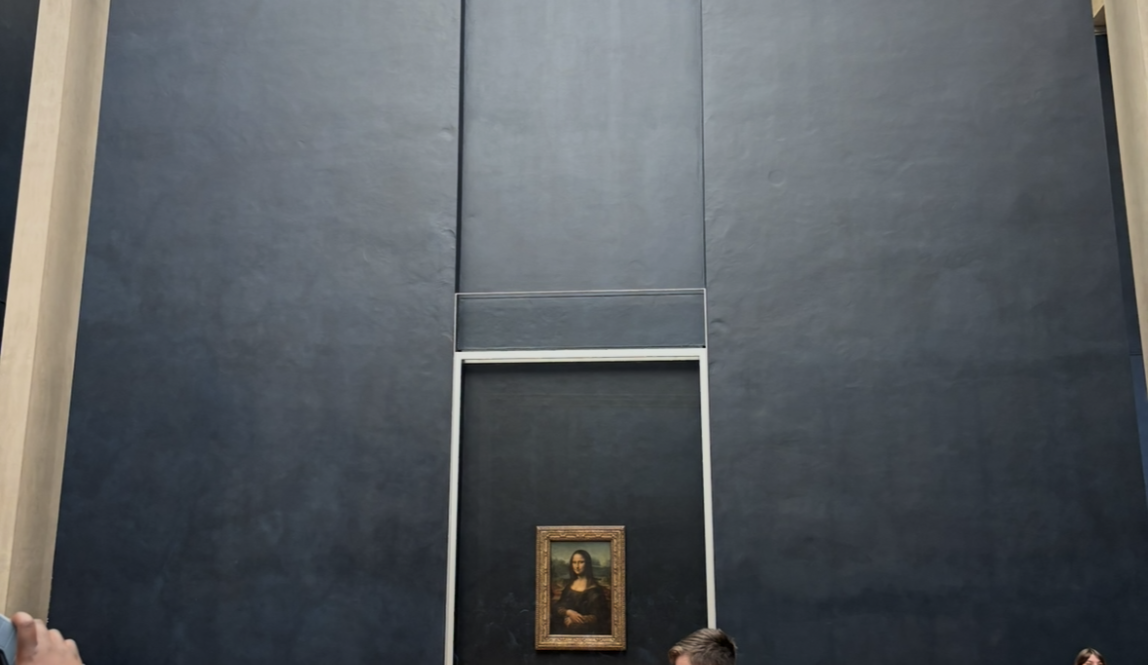 A faraway view of the famous Mona Lisa at the Louvre museum