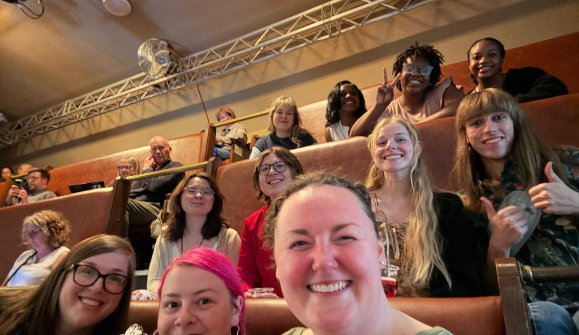 London theatre faculty and students sitting in a theatre. 