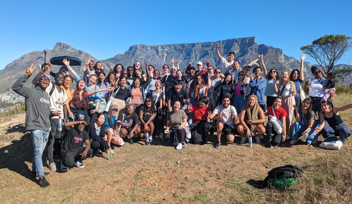 Denisse Luz Ramos Guzman smiling with friends while living in Cape Town, South Africa.